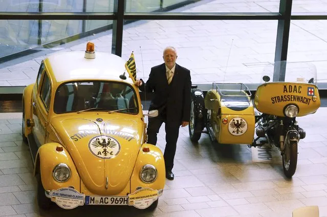 August Markl, newly-elected president of the German automobile club ADAC, poses for photographers after an extraordinary membership meeting in Munich December 6, 2014. Markl was elected by some 190 delegates who met to decide on a extensive reform of the car club after a scandal in a survey to identify their favorite car was manipulated. (Photo by Michael Dalder/Reuters)
