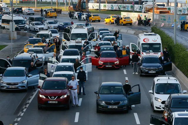 People get out of their cars and stand in silence on 09:05 a.m., the death time of Mustafa Kemal Ataturk, founder of the Republic of Turkey, during the 82nd anniversary of his demise, in Izmir, Turkey on November 10, 2020. As is customary, daily life stopped at 9.05 a.m. local time (0605GMT), sirens wailed to mark the exact moment of Ataturks death at the age of 57 and millions of people across the country observed two minutes of silence. (Photo by Omer Evren Atalay/Anadolu Agency via Getty Images)