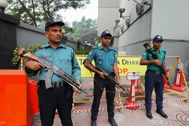 Police stand guard outside the Westin Hotel in Dhaka where Australia's national football team is staying November 17, 2015, ahead of their 2018 World Cup qualifying soccer match against Bangladesh later in the day. (Photo by Ashikur Rahman/Reuters)