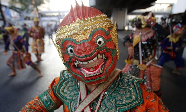 Actors representing Hanuman, a monkey god featured in the classic Indian Ramayana epic, also adopted into the culture of Thailand, perform during a parade in Bangkok to promote tourism Wednesday, January 14, 2015. (Photo by Sakchai Lalit/AP Photo)