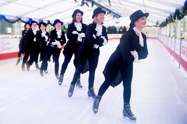 To celebrate World Ice Skating Day on 14 December, staff from the National Galleries of Scotland ice skating to recreate one of the most iconic paintings from Scotland's collection, Sir Henry Raeburn's Skating Minister on Tuesday, December 9, 2025. Teaming up with Edinburgh's Christmas, the skating ministers took to the ice rink on George Street to imitate the painting. Painted around 1795, the artwork is actually named Reverend Robert Walker Skating on Duddingston Loch, but has become fondly referred to as the Skating Minister. (Photo by Jane Barlow/PA Images via Getty Images)
