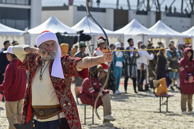 An archer, wearing traditional clothing, shoots an arrow during the traditional Turkish archery competitions, which are on the UNESCO Intangible Cultural Heritage list, within the 5th World Nomad Games in Astana, Kazakhstan on September 11, 2024. (Photo by Muhammed Enes Yildirim/Anadolu via Getty Images)