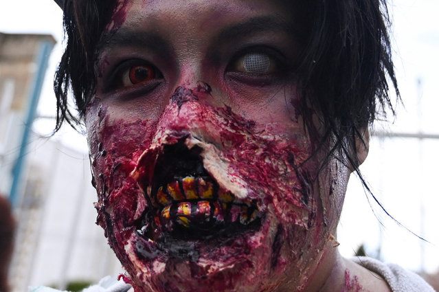 A woman with makeup takes part in the zombie walk that kicks off the Halloween festivities, in La Paz, Bolivia on October 26, 2024. (Photo by Claudia Morales/Reuters)