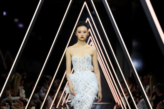 A model presents a creation by designers Tamara Ralph and Michael Russo as part of their Haute Couture Fall/Winter 2018/2019 collection show for fashion house Ralph & Russo in Paris, France, July 2, 2018. (Photo by Gonzalo Fuentes/Reuters)