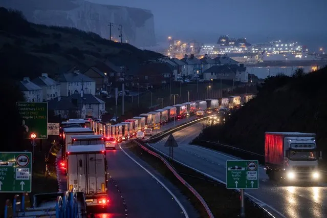 Lorries queue on the route into Dover Port to board ferries to France on December 11, 2020 in Dover, United Kingdom. The trade deal negotiations between the EU and the UK have reached an impasse with negotiators stuck on two points: a so-called level playing field to ensure fair competition between companies and fishing quotas. Negotiators from both sides have until Sunday to reach a deal or the UK will leave the EU with no deal and will begin trading on WTO terms. (Photo by Dan Kitwood/Getty Images)