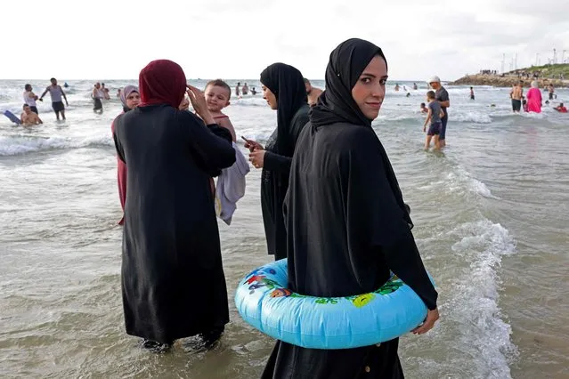 Palestinians gather at the beach in Israel's coastal city of Tel Aviv on June 29, 2023 on the second day of the Eid al-Adha Muslim holiday. (Photo by Menahem Kahana/AFP Photo)