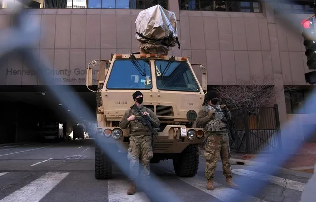 Members of the National Guard stand guard in front of the Hennepin County Government Center on the first day of the trial of former Minneapolis police officer Derek Chauvin, on murder charges in the death of George Floyd in Minneapolis, Minnesota, U.S., March 8, 2021. (Photo by Leah Millis/Reuters)