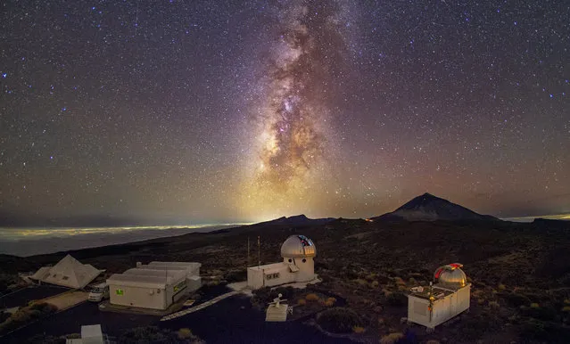 In this image released on Thursday, July 26, 2018, is the Teide Observatory, Izana, Tenerife. The Milky Way is hidden from more than one-third of humanity. For an even better view of the stars, Signify has installed astronomer friendly street lighting in the Canary Islands, minimising city light spilling into the night sky. (Photo by Daniel Lopez/IAC/Signify via AP Images)