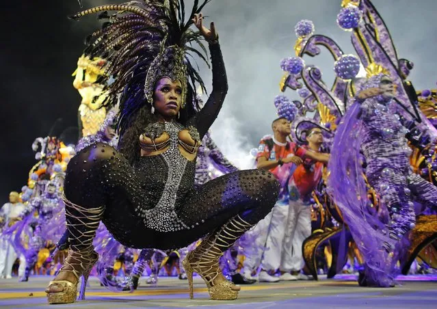 A reveller from the Rosas de Ouro Samba School takes part in a carnival at Anhembi Sambadrome in Sao Paulo February 14, 2015. (Photo by Nacho Doce/Reuters)
