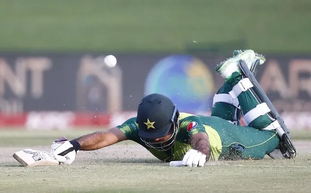 Pakistan's Fakhar Zaman dives to make his crease during the fourth Twenty20 international cricket match between South Africa and Pakistan at SuperSport Park in Centurion on April 16, 2021. (Photo by Phill Magakoe/AFP Photo)