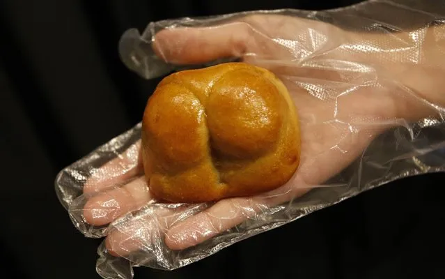 The “T-back” buttock-shaped mooncakes sold by Hong Kong lifestyle label Goods of Desire (G.O.D) are shown ahead of the Mid-Autumn festival in Singapore September 10, 2013. The odd-looking mooncakes are a tongue-in-cheek reference to the 15th of the eighth lunar month, which is Cantonese colloquial euphemism for buttocks, according to G.O.D. owner Douglas Young in media reports. Each box retails for $41 and consists of four different pieces of mooncakes which depicts human buttocks wearing thongs, a torn pair of trousers and one bare buttock covered by only a hand. Mid-Autumn festival falls on September 19 this year. (Photo by Edgar Su/Reuters)