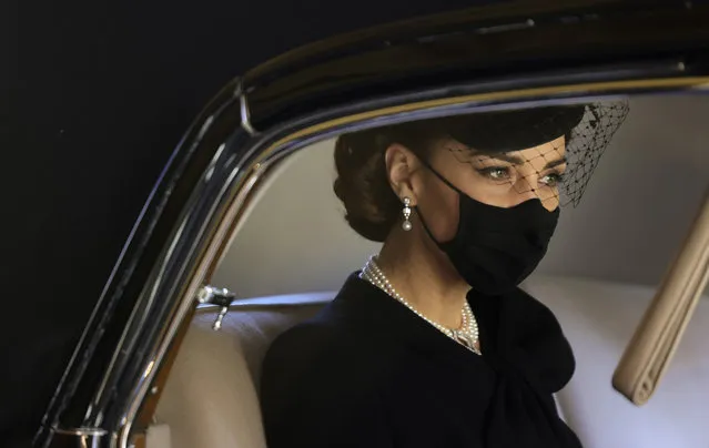 Kate, Duchess of Cambridge looks out from a car window as she arrives for the funeral of Britain's Prince Philip inside Windsor Castle in Windsor, England, Saturday, April 17, 2021. Prince Philip died April 9 at the age of 99 after 73 years of marriage to Britain's Queen Elizabeth II. (Photo by Chris Jackson/Pool via AP Photo)
