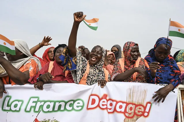 Supporters of Niger's National Council of Safeguard of the Homeland (CNSP) protest outside the Niger and French airbase in Niamey on August 30, 2023 to demand the departure of the French army from Niger. (Photo by AFP Photo/Stringer)