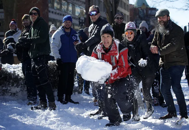 People participate in a snowball fight at Dupont Circle January 24, 2016 in Washington, DC. (Photo by Alex Wong/Getty Images)