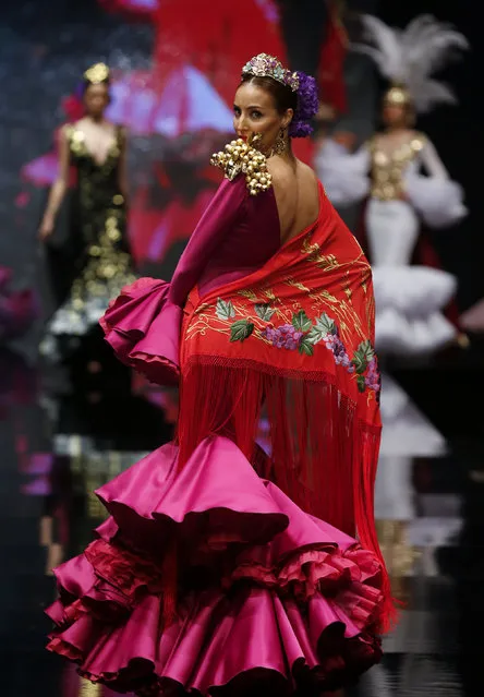 A model presents a creation by Luis Fernandez during the International Flamenco Fashion Show SIMOF in the Andalusian capital of Seville, Spain, February 5, 2016. (Photo by Marcelo del Pozo/Reuters)