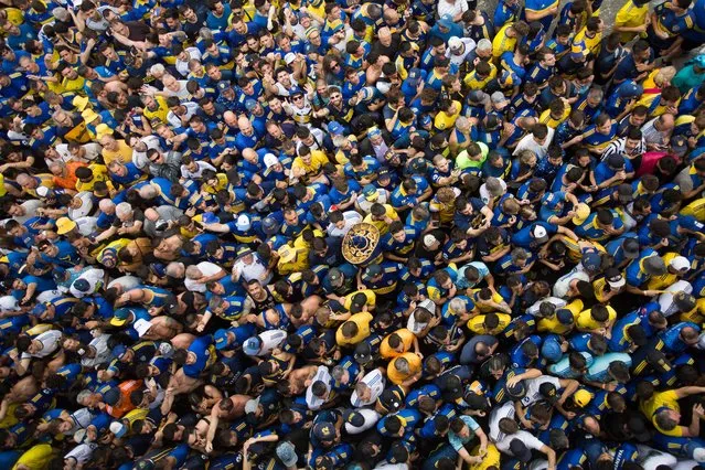 Fans of Boca Juniors queue outside Maracana Stadium in Rio de Janeiro, Brazil, before the Copa Libertadores final football match between Brazil's Fluminense and Argentina's Boca Juniors, on November 4, 2023. (Photo by Daniel Ramalho/AFP Photo)