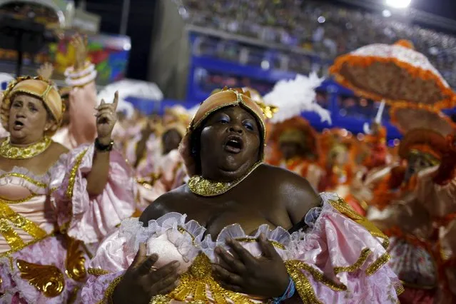 A reveller of Beija-Flor performs during the carnival parade at the Sambadrome in Rio de Janeiro, February 7, 2016. (Photo by Pilar Olivares/Reuters)