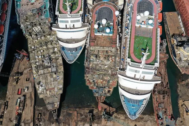 A drone image shows decommissioned cruise ships being dismantled  for scrap metal sales after the COVID-19 pandemic all but destroyed the industryat Aliaga ship-breaking yard in the Aegean port city of Izmir, western Turkey, October 2, 2020. (Photo by Umit Bektas/Reuters)
