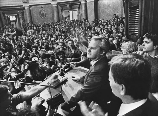 Serbia's communist Party leader Slobodan Milosevic meets with workers, 06 October 1988 inside the federal parliament in Belgrade. (Photo by STF/TANJUG/AFP Photo)