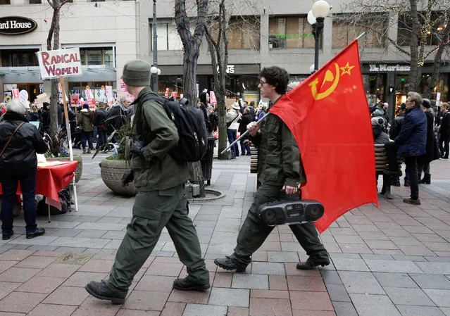 People dressed up as soldiers from the former Soviet Union walk near a protest to U.S. President Donald Trump's inauguration in Seattle, Washington, U.S. January 20, 2017. (Photo by Jason Redmond/Reuters)
