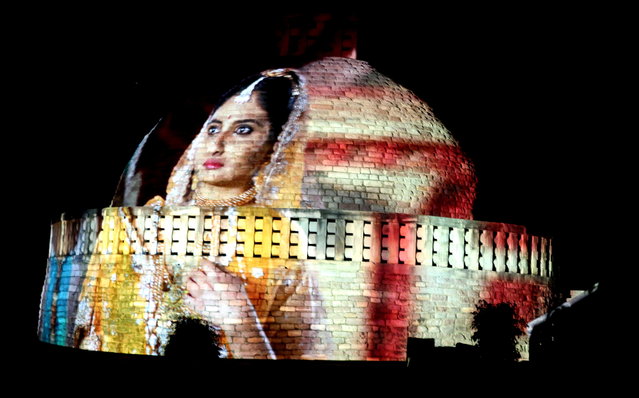 A projected image illuminates Sanchi Stupa, a world heritage site, during the “Light and Sound” show in Sanchi, India, 01 March 2019 (issued 02 March 2019). The show was organized by Madhya Pradesh State Tourism Development Corporation to showcase the importance of heritage sites, Buddha's philosophy and its contribution to the society. (Photo by Sanjeev Gupta/EPA/EFE)