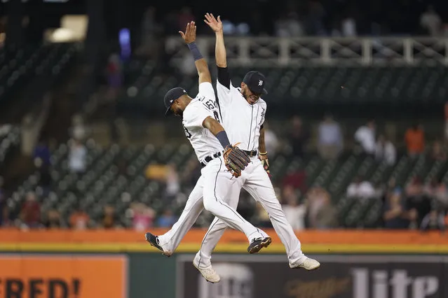 Detroit Tigers’ Willi Castro, left, and Harold Castro, right, celebrate after the final out in the ninth inning of a baseball game against the Chicago White Sox in Detroit, Monday, September 20, 2021. Detroit won 4-3. (Photo by Paul Sancya/AP Photo)