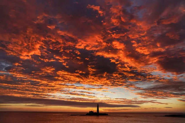 Sunrirse over St Mary's Lighthouse at Whitley Bay on the North East coast of England on Friday, September 24, 2021. (Photo by Owen Humphreys/PA Images via Getty Images)