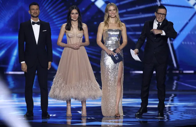Eurovision hosts from left, Assi Azar, Lucy Ayoub, Bar Refaeli, and Erez Tal walk onto the stage for the start of the 2019 Eurovision Song Contest grand final in Tel Aviv, Israel, Saturday, May 18, 2019. (Photo by Sebastian Scheiner/AP Photo)