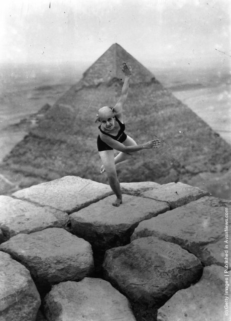 1928: A woman dancing on the Sphinx. A pyramid can be seen in the background