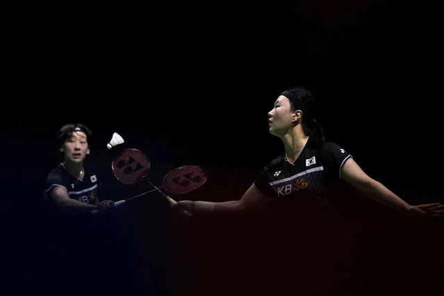 South Korea's Shin Seungchan, playing with Lee Sohee, left, returns a shot to Japan's Aoi Matsuda and Chisato Hoshi during their Women's/ badminton doubles match at the BWF World Championships in Huelva, Spain, Wednesday, December 15, 2021. (Photo by Manu Fernandez/AP Photo)
