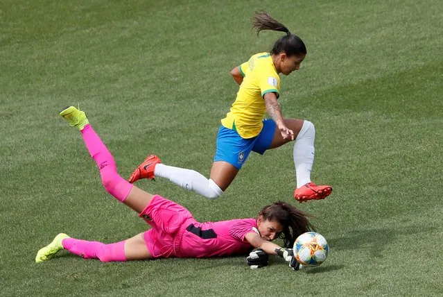 Brazil's forward Debinha (up) vies with Jamaica's goalkeeper Sydney Schneider during the France 2019 Women's World Cup Group C football match between Brazil and Jamaica on June 9, 2019, at the Alpes Stadium in Grenoble, central-eastern France. (Photo by Emmanuel Foudrot/Reuters)