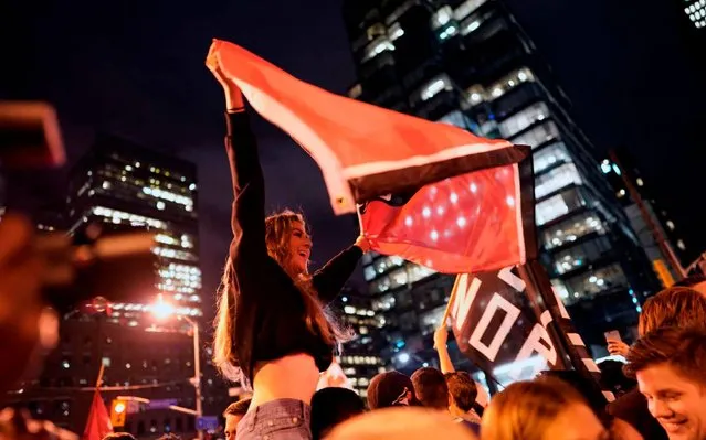 Toronto Raptors fans celebrate their win in the NBA championships in downtown Toronto, Ontario on early June 14, 2019. (Photo by Geoff Robins/AFP Photo)