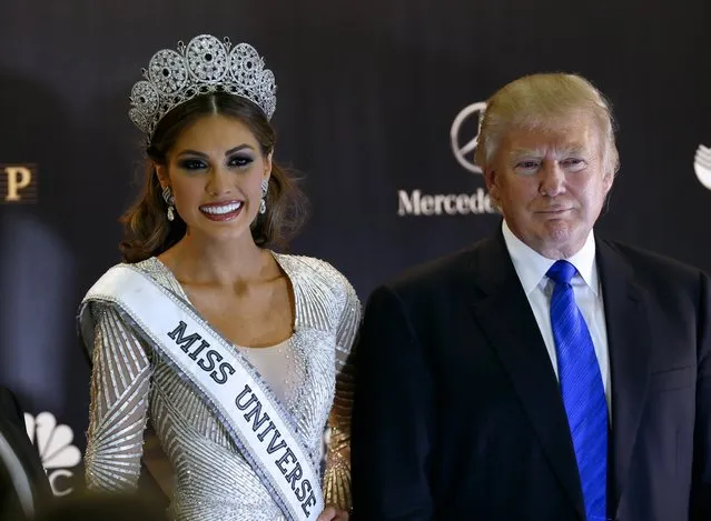 In this Sunday, November 10, 2013 file photo, Miss Universe 2013 Gabriela Isler, from Venezuela, left, and pageant owner Donald Trump, of the United States, pose for a photo after the 2013 Miss Universe pageant in Moscow, Russia. Despite saying he wanted to build a Trump tower in Russia, Donald Trump never completed a deal in the country's booming – but volatile – real estate and hotel market. (Photo by Ivan Sekretarev/AP Photo)