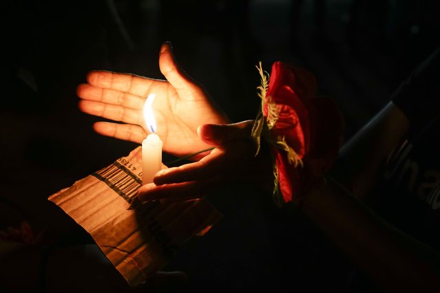 Salvadoran women participate in a vigil in memory of women victims of femicide in the commemoration of the International Day for the Elimination of Violence against Women, in San Salvador, capital of El Salvador on November 25, 2021. (Photo by Alex Pena/Anadolu Agency via Getty Images)