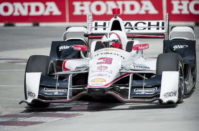 Helio Castroneves, of Brazil, makes a corner during practice for the IndyCar auto race, Saturday, June 13, 2015, in Toronto. (Nathan Denette/The Canadian Press via AP)