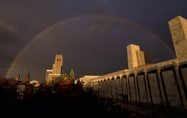 A rainbow appears in the winter sky over New York state agency buildings, at right, and downtown Albany, N.Y., after a thunderstorm on Sunday, January 10, 2016. (Photo by Mike Groll/AP Photo)