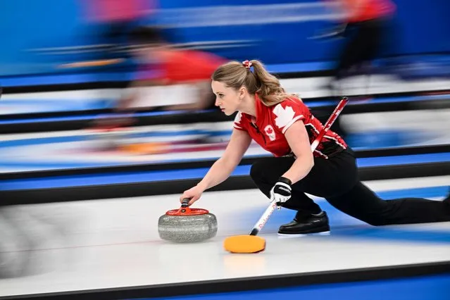Canada’s Jocelyn Peterman curls the stone during the women’s round robin session 7 game of the Beijing 2022 Winter Olympic Games curling competition between Russia’s Olympic Committee and Canada, at the National Aquatics Centre in Beijing on February 14, 2022. (Photo by Lillian Suwanrumpha/AFP Photo)