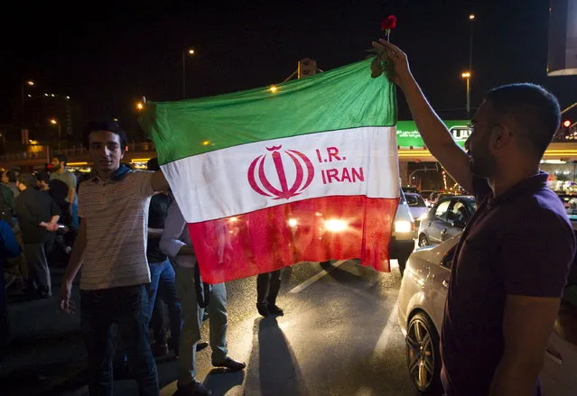 Iranians celebrate on the streets following a nuclear deal with major powers, in Tehran July 14, 2015. (Photo by Reuters/TIMA)