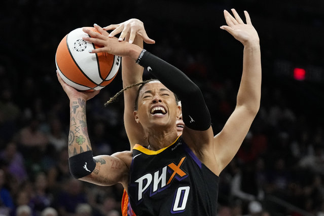 Phoenix Mercury guard Natasha Cloud (0) gets fouled by Connecticut Sun guard Veronica Burton during the second half of a WNBA basketball game Monday, July 1, 2024, in Phoenix. The Sun won 83-72. (Photo by Ross D. Franklin/AP Photo)