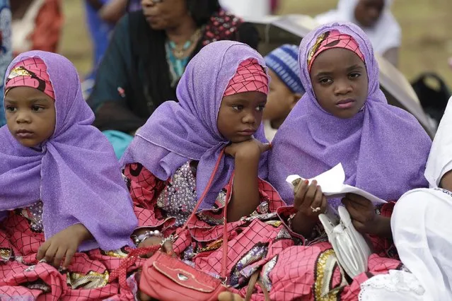 Nigeria Muslim girls attend Eid al-Fitr prayer, marking the end of the Muslim holy fasting month of Ramadan in Lagos, Nigeria, Friday, July 17, 2015. (Photo by Sunday Alamba/AP Photo)