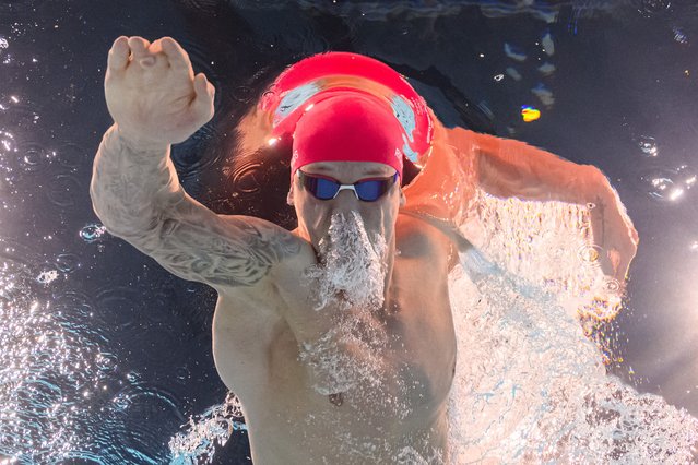 An underwater view shows Britain's Matthew Richards competing in a heat of the men's 200m freestyle swimming event during the Paris 2024 Olympic Games at the Paris La Defense Arena in Nanterre, west of Paris, on July 28, 2024. (Photo by François-Xavier Marit/AFP Photo)