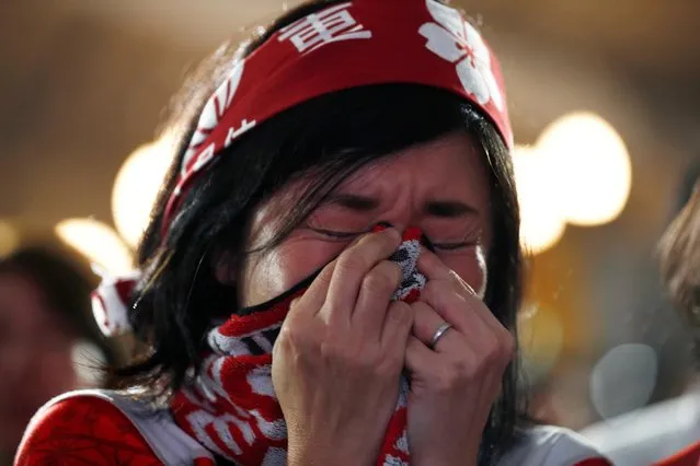 A Japan fan reacts after their World Cup Rugby quarter final match against South Africa in Oita, Japan on October 20, 2019. (Photo by Edgar Su/Reuters)