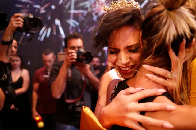 Talin Abu Hanah, an Israeli Arab, reacts after winning the first-ever Miss Trans Israel beauty pageant in Tel Aviv, Israel May 27, 2016. (Photo by Amir Cohen/Reuters)