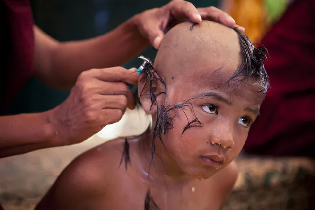 “Boy becomes monk”. A young boy undergoes the ceremony to become a monk in Bagan. Photo location: Myanmar. (Photo and caption by Marcelo Salvador/National Geographic Photo Contest)