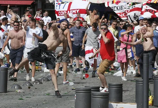 Football Soccer, Euro 2016, England vs Russia, Group B, Stade Velodrome, Marseille, France on June 11, 2016. England supporters throw projectiles at the old port of Marseille before the game. (Photo by Jean-Paul Pelissier/Reuters)