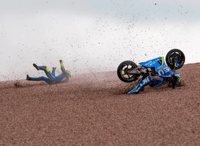 Suzuki Ecstar rider Italian Andrea Iannone falls during the first training session of the Moto Grand Prix of Germany at the Sachsenring Circuit on June 30, 2017 in Hohenstein- Ernstthal, eastern Germany. (Photo by Robert Michael/AFP Photo)