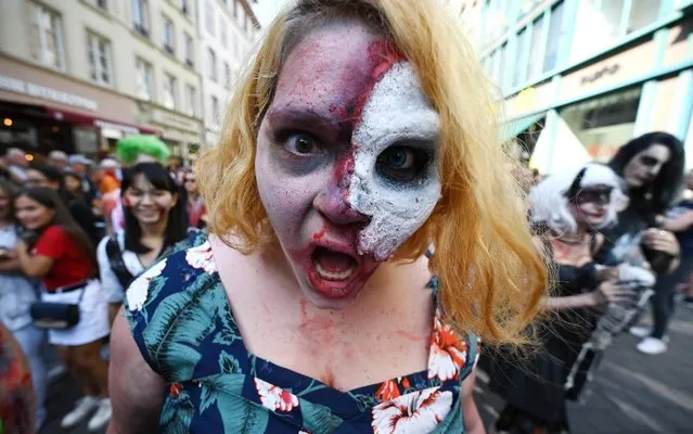 Enthusiast dressed as zombies take part in the Zombie Walk event on September 14, 2019 in the eastern French city of Strasbourg, within the framework of the 12th edition of the European Fantastic Film festival, which runs from September 14 to 22. (Photo by Frederick Florin/AFP Photo)