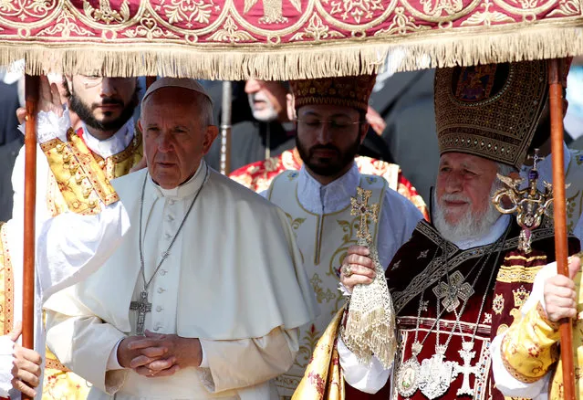 Pope Francis and Catholicos of All Armenians Karekin II arrive for the Divine Liturgy at the apostolic Cathedral in Etchmiadzin, Armenia, June 26, 2016. (Photo by David Mdzinarishvili/Reuters)