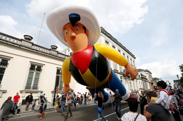 A giant balloon of comic strip character Lucky Luke floats during the Balloon Day Parade along the downtown boulevards, as part of the “Comic Strip Festival”, in Brussels, Belgium September 3, 2017. (Photo by Francois Lenoir/Reuters)
