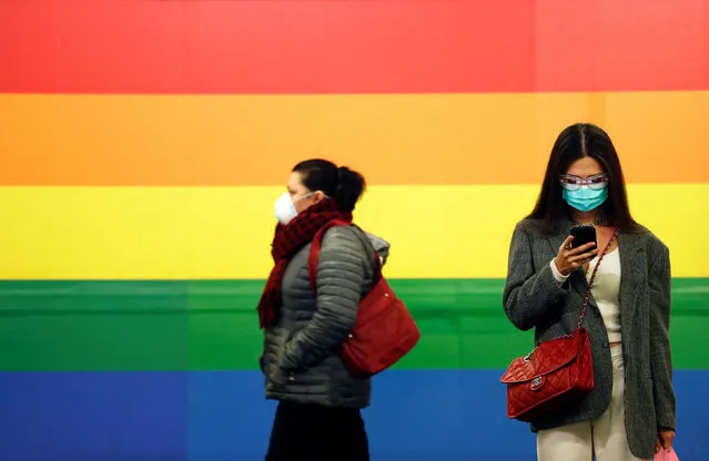 Women in a face masks are seen in Porta Venezia subway in Milan, as the country is hit by the coronavirus outbreak, Italy on February 25, 2020. (Photo by Yara Nardi/Reuters)